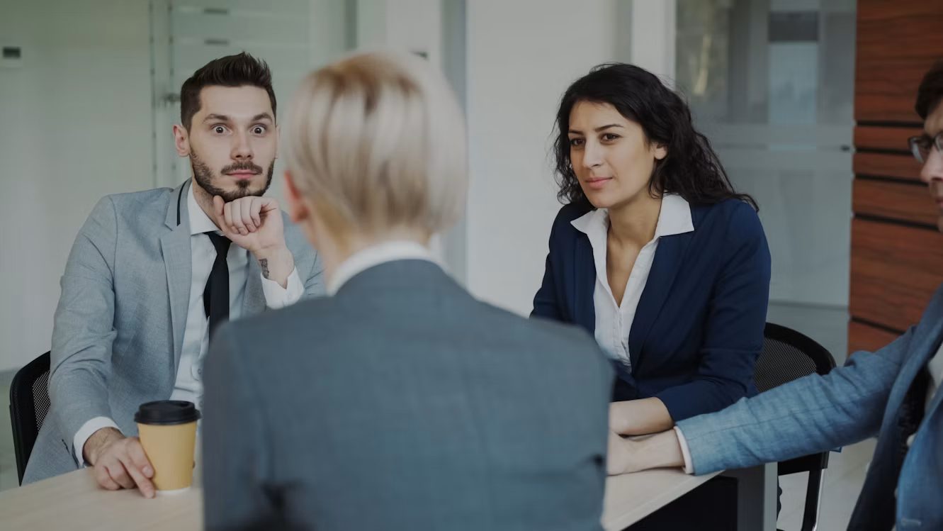 Business colleagues discussing their work around a table